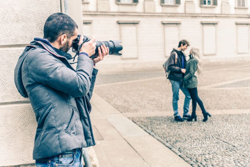 A photographer taking a photo of a couple