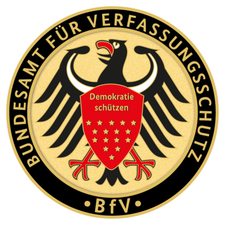 A logo featuring a bird and a shield.