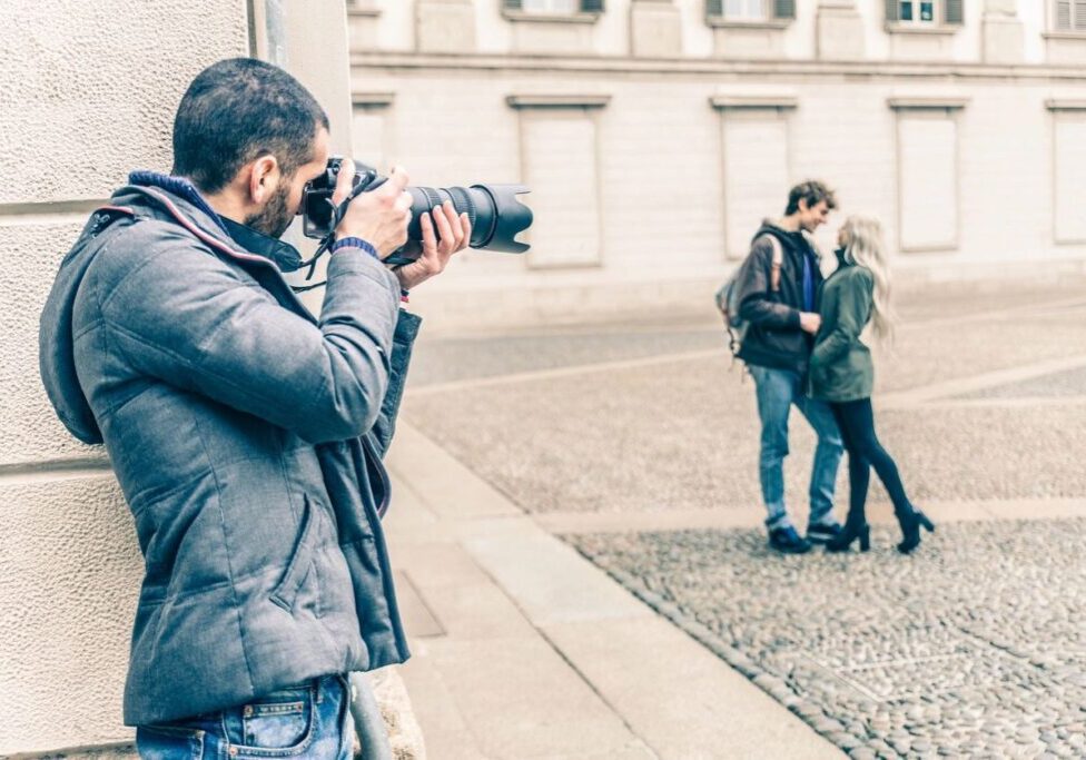 A photographer taking a photo of a couple